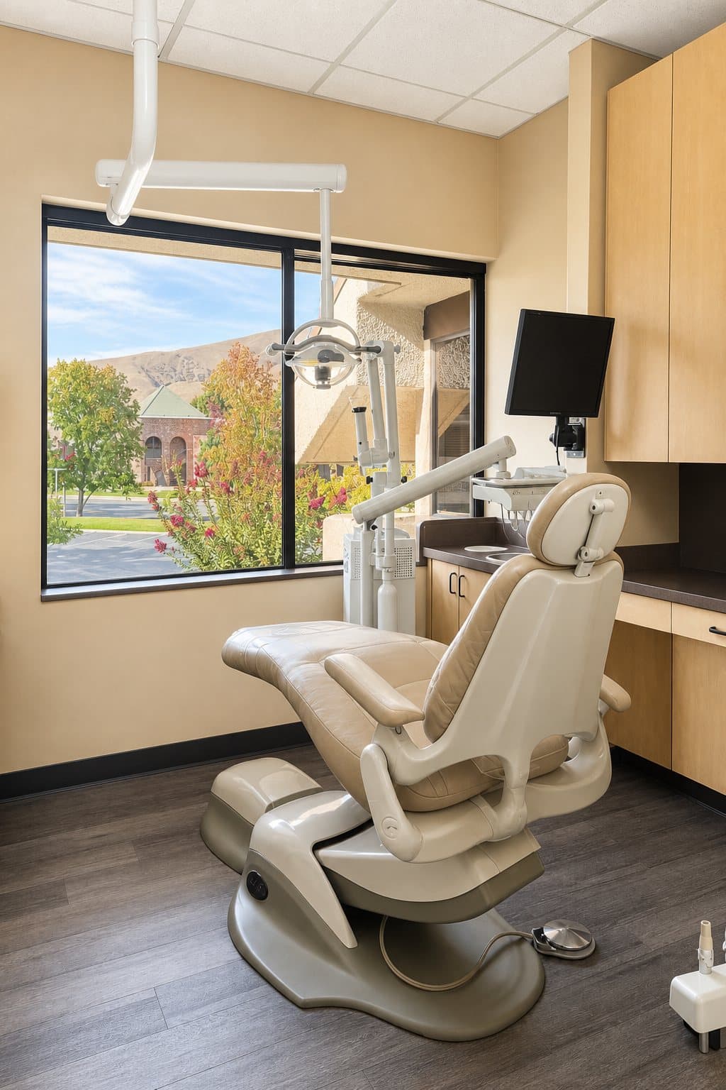 Treatment room with a window view of trees and hills