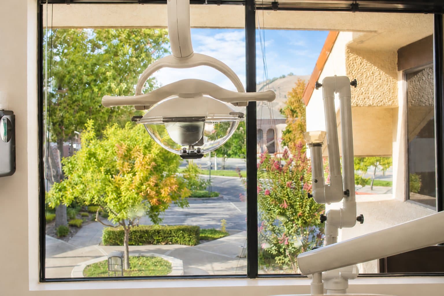 Window view from a treatment room, with the dental light in the foreground